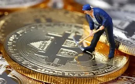 A cryptocurrency miner carefully examining an ASIC chip, highlighting the technical expertise involved in maintaining mining hardware.